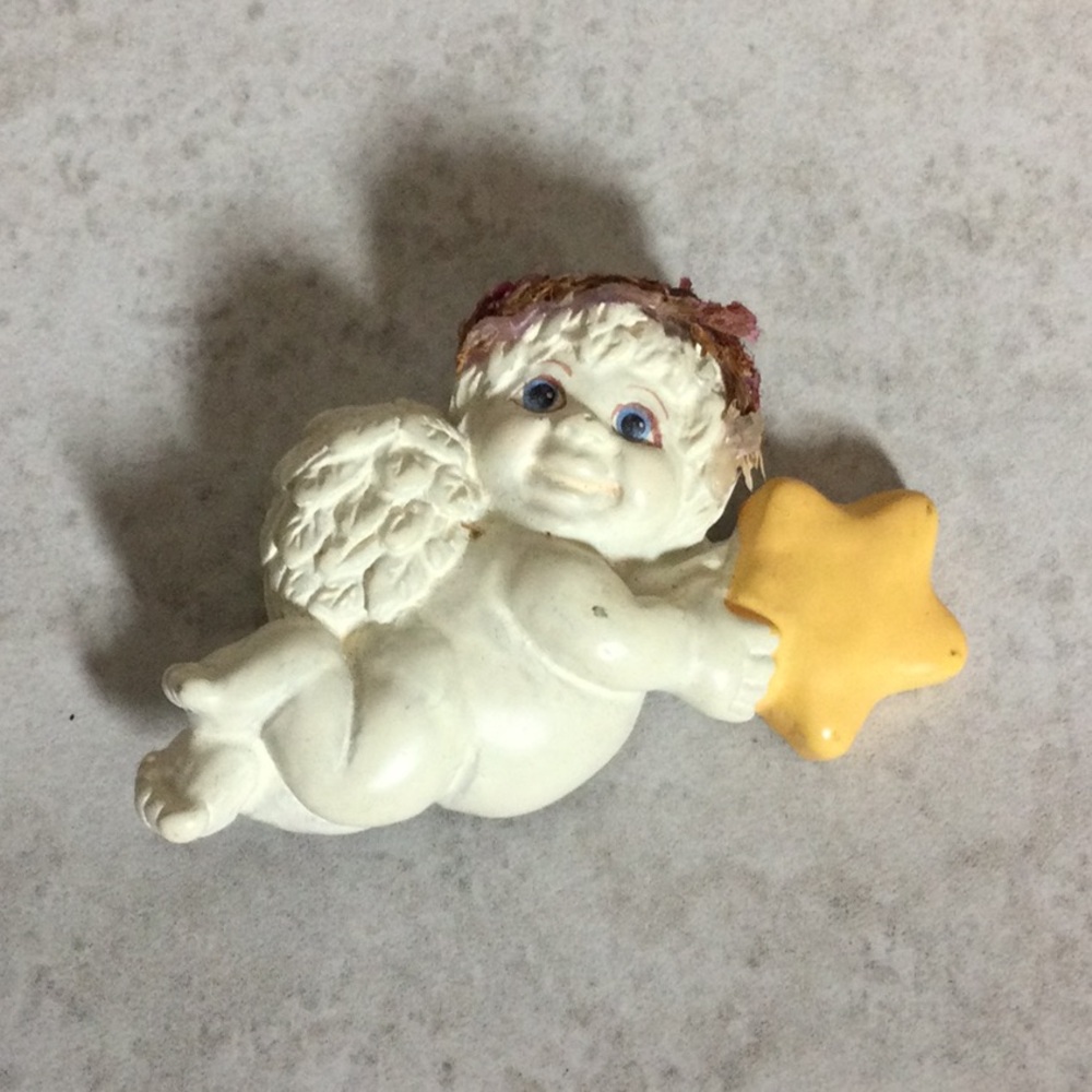 Cupid with star brooch